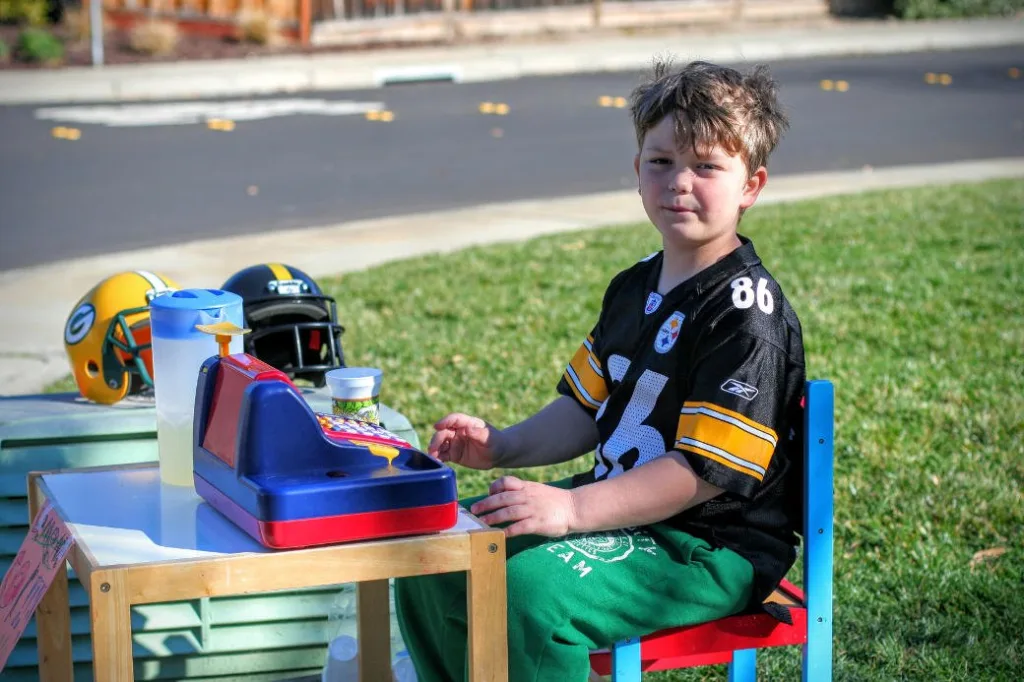boy selling lemonade