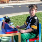 boy selling lemonade