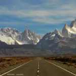 road leading to mountain peaks