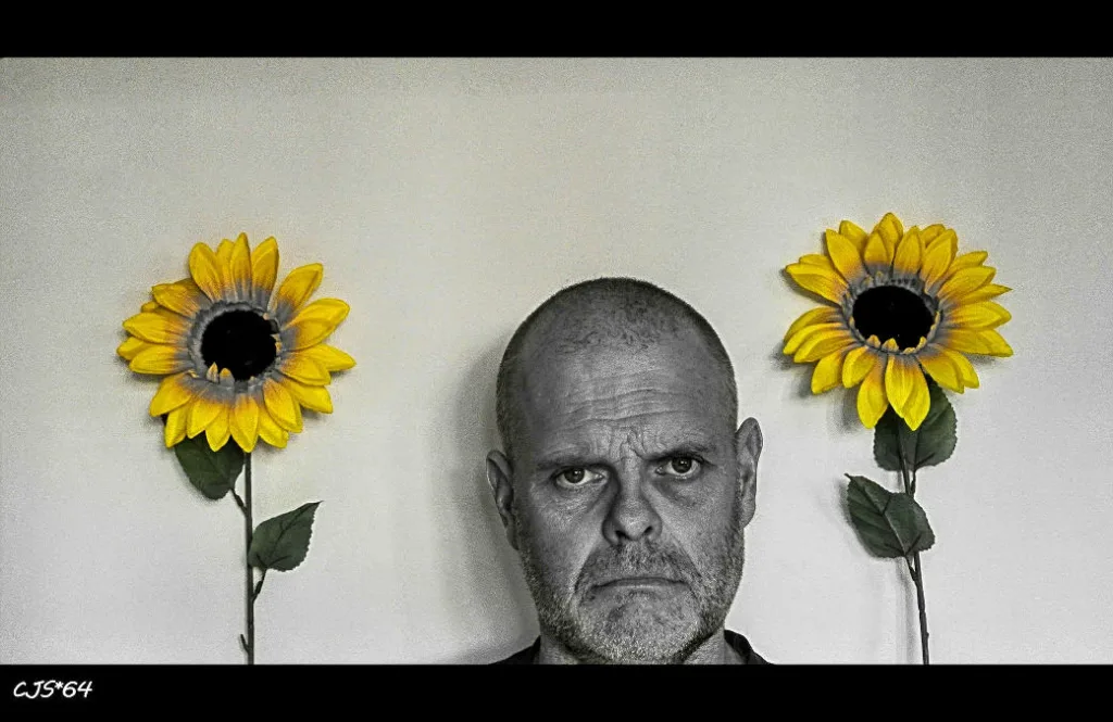 unhappy man with sunflowers