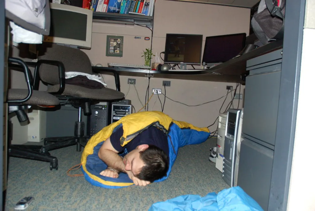 sleeping under work desk