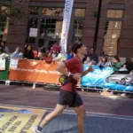 Dave crossing marathon finish line