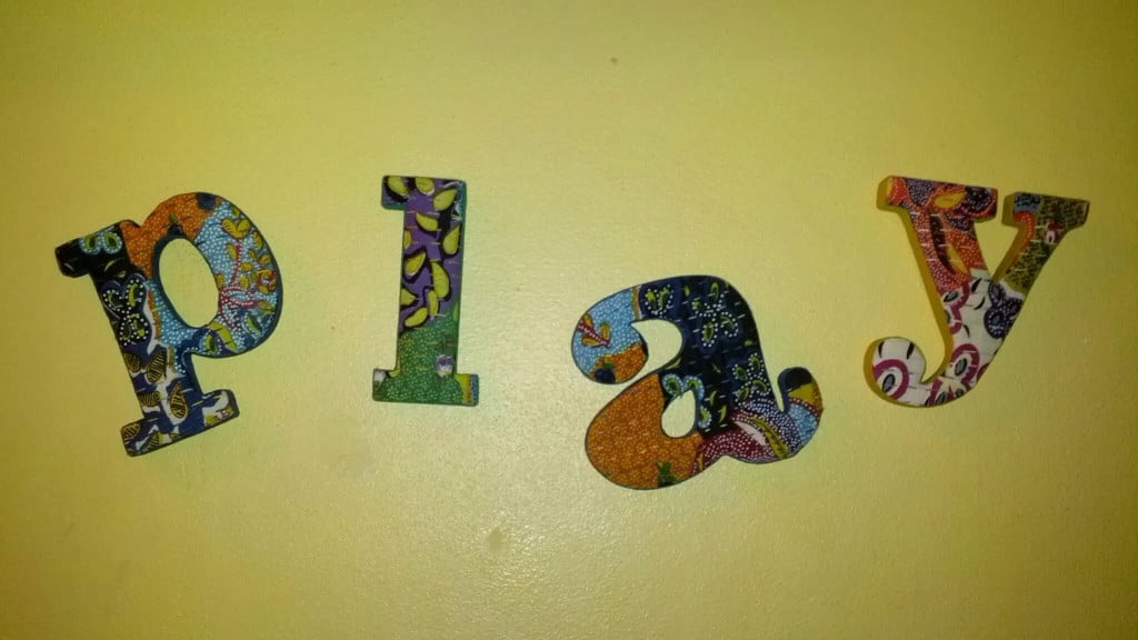 play in colorfully patterned letters