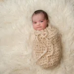 infant bundled in pouch